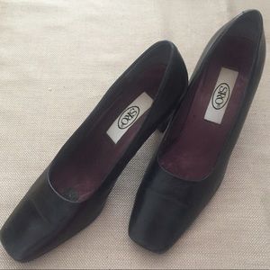 Black leather square toe pumps